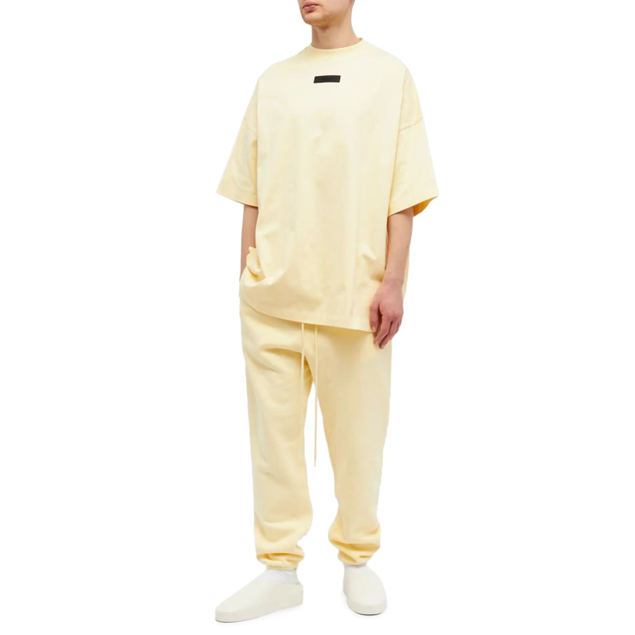 Model view of Fear of God Essentials SS Garden Yellow T Shirt (FW23) 125SP244191F